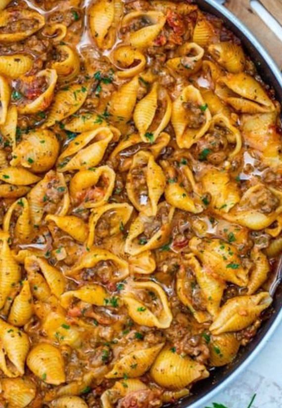 creamy beef and shells in a skillet