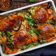 oven baked chicken and rice on a sheet pan