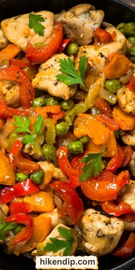 chicken and vegetables stir fry in a skillet