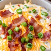 million dollar crack dip in a bowl with bacon and cheese