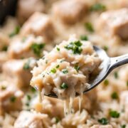 parmesan chicken and rice in a black skillet